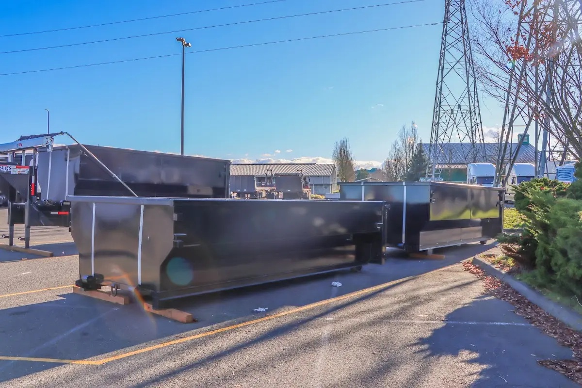 Roll-off dumpster ready for waste disposal at job site for Concrete Dumpster Rental in Lakewood